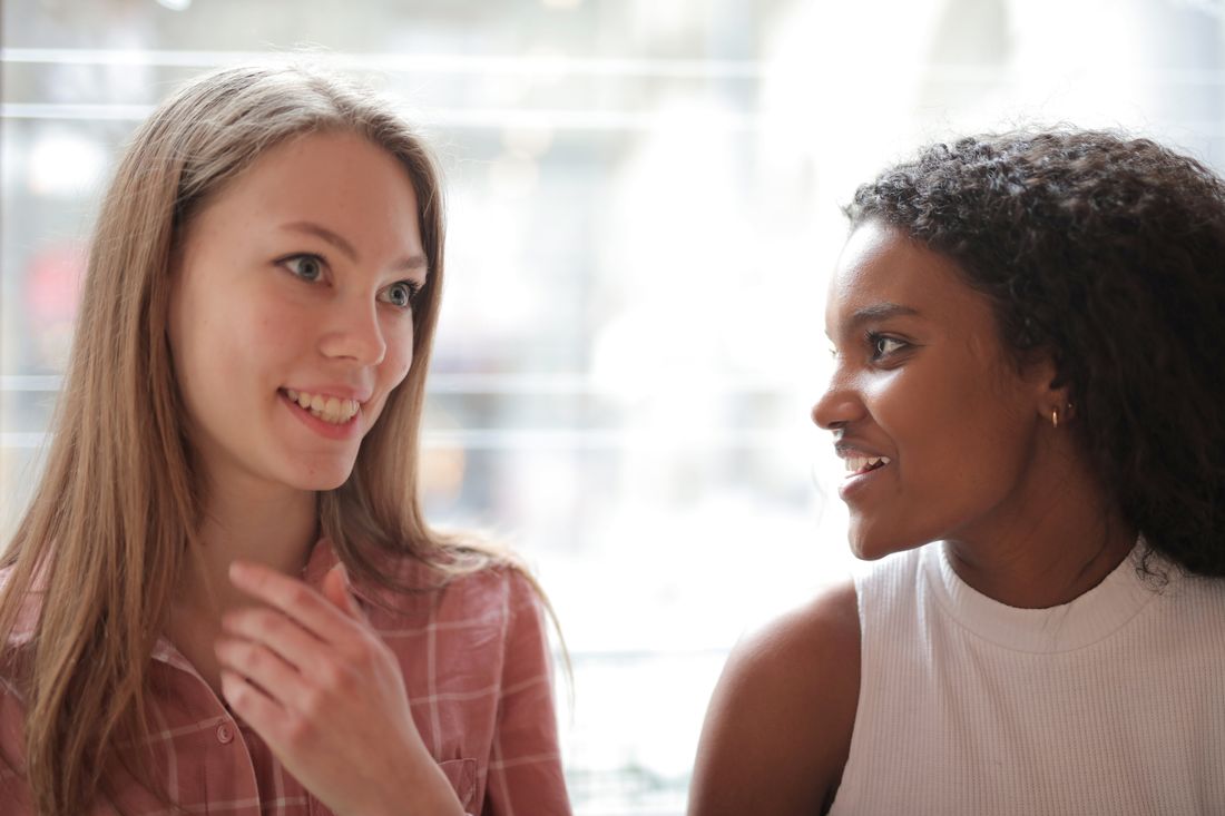 Two people sharing a warm, kind moment